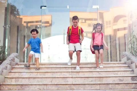 Back to school. Pupils with backpacks going to school Stock Photos