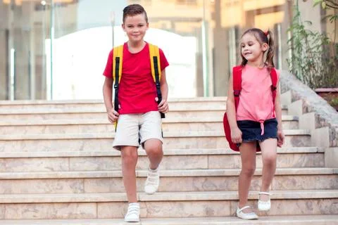Back to school. Pupils with backpacks going to school Stock Photos