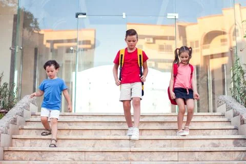 Back to school. Pupils with backpacks going to school Stock Photos