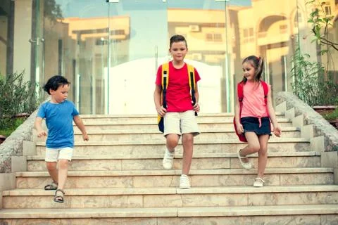 Back to school. Pupils with backpacks going to school Stock Photos