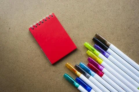 Back to school. The red pages of the notebook. Holiday notes. Colorful marker Foto stock