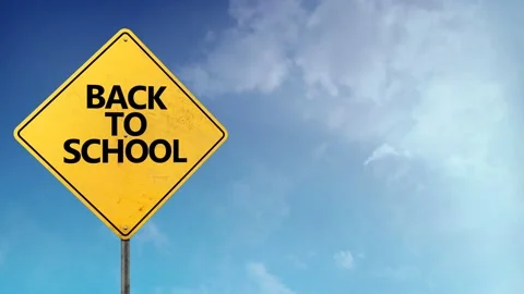 Back to School Road Sign Blue Skies 4K Loop Stock Footage 145147970