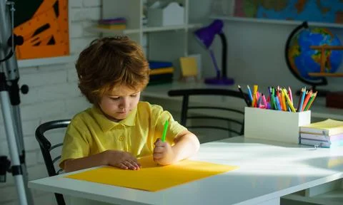 Back to school. Schoolboy doing school homework for elementary school. Cute.. Stock Photos