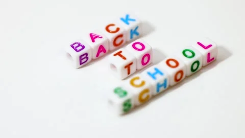 Back to school spelled out on white beads on white background. Stock Footage 316266926