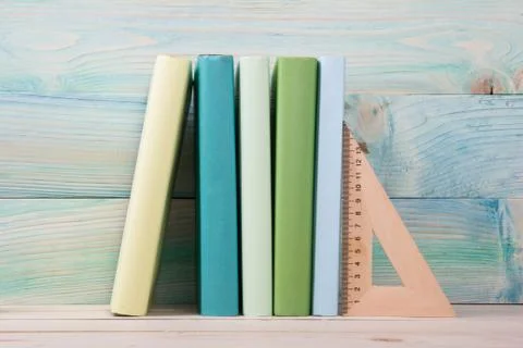 Back to school. Stack of colorful books on wooden table. Copy space Stock Photos
