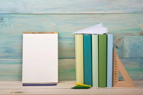 Back to school. Stack of colorful books on wooden table. Copy space Stock-Fotos