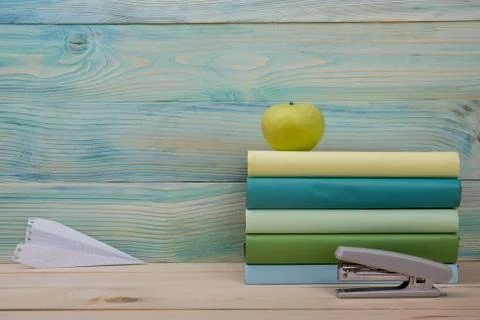 Back to school. Stack of colorful books on wooden table. Copy space Stock Photos