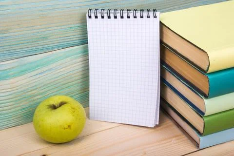 Back to school. Stack of colorful books on wooden table. Copy space Stock Photos