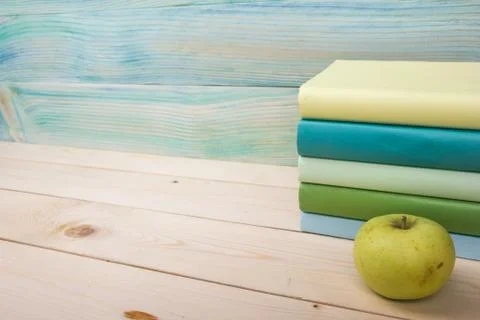 Back to school. Stack of colorful books on wooden table. Copy space Foto stock