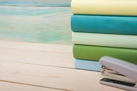 Back to school. Stack of colorful books on wooden table. Copy space 스톡 사진