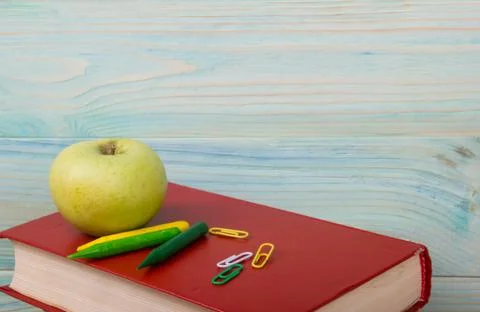 Back to school. Stack of colorful books on wooden table. Copy space Stock Photos