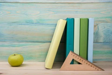 Back to school. Stack of colorful books on wooden table. Copy space Stock Photos