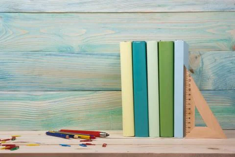 Back to school. Stack of colorful books on wooden table. Copy space Stock-Fotos
