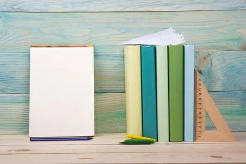 Back to school. Stack of colorful books on wooden table. Copy space Foto stock