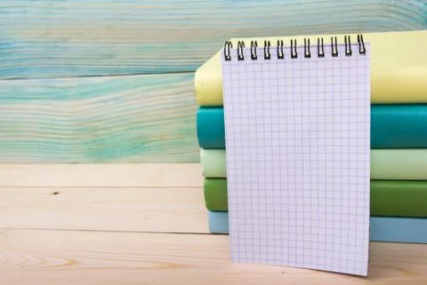 Back to school. Stack of colorful books on wooden table. Copy space Foto stock