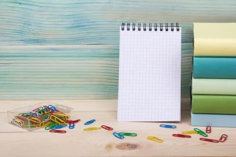 Back to school. Stack of colorful books on wooden table. Copy space Stock Photos