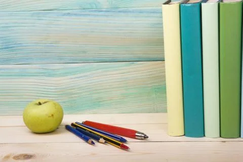 Back to school. Stack of colorful books on wooden table. Copy space Stock Photos