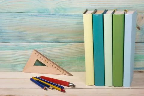 Back to school. Stack of colorful books on wooden table. Copy space Stock-Fotos