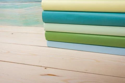 Back to school. Stack of colorful books on wooden table. Copy space Stock-Fotos