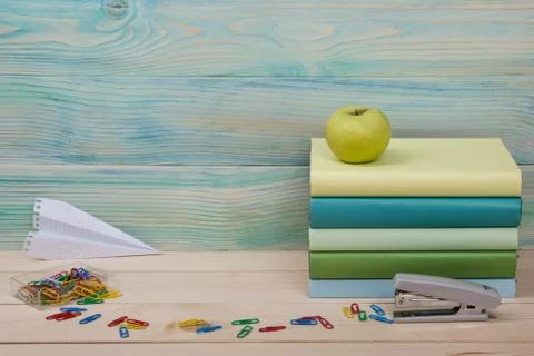 Back to school. Stack of colorful books on wooden table. Copy space Stock Photos