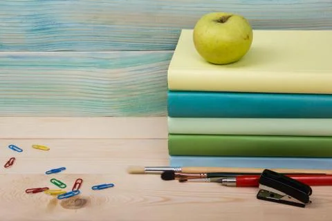 Back to school. Stack of colorful books on wooden table. Copy space Stock Photos