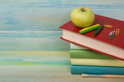 Back to school. Stack of colorful books on wooden table. Copy space Stock Photos