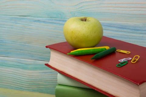 Back to school. Stack of colorful books on wooden table. Copy space Stock Photos