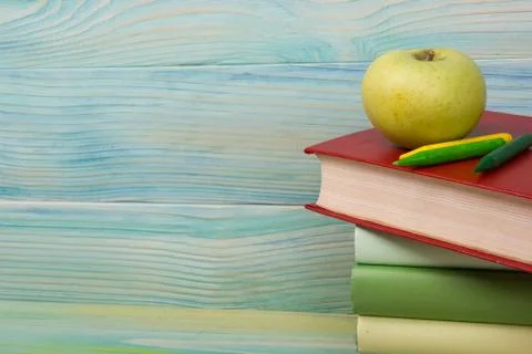 Back to school. Stack of colorful books on wooden table. Copy space Stock Photos