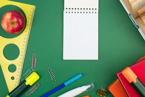 Back to school. Stationery on a green table. Office desk with copy space. F.. Stock Photos