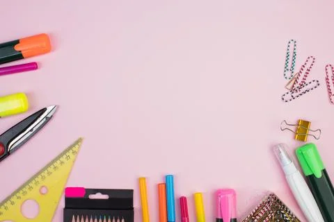 Back to school. Stationery on a pink table. Office desk with copy space. Fl.. Stock Photos