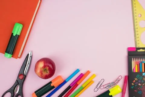 Back to school. Stationery on a pink table. Office desk with copy space. Fl.. Stock Photos