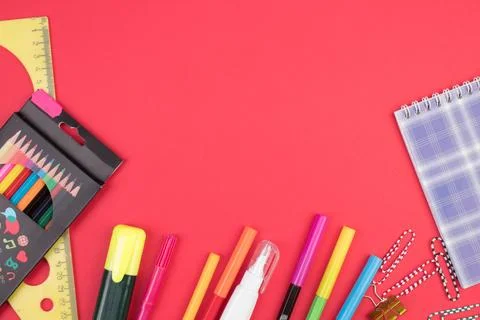 Back to school. Stationery on a red table. Office desk with copy space. Flat  Stock Photos