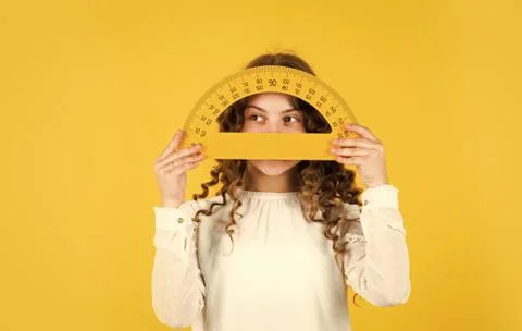 Back to school. Student learning geometry yellow background. Measure angles in 스톡 사진