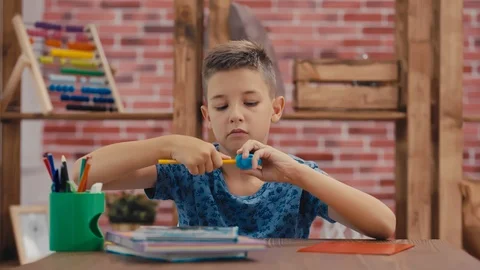 Back to school. Student sharpening a pencil. Video stock 92781769