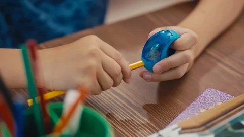 Back to school. Student sharpening a pencil. 動画素材 92781831