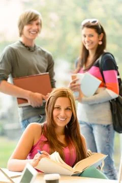 Back to school students studying in library Stock Photos