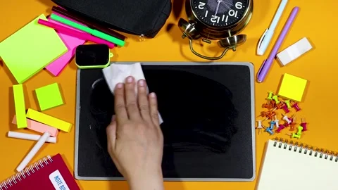 Back to school supplies, and hand woman erasure chalkboard with wipes Stock Footage 284741865
