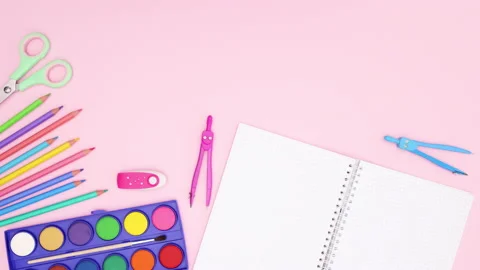 Back to school supplies and open notebook move on bottom - Stop motion Stock Footage 131958058
