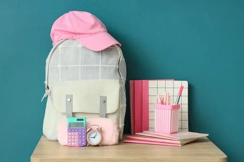 Back to school supplies with backpack, calculator, alarm clock and notebooks Stock Photos