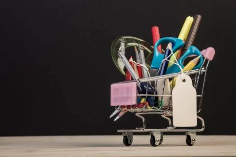 Back to school template with multiple stationery in trolley with price tag ag Stock Photos