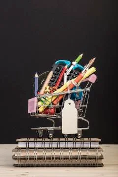 Back to school template with multiple stationery in trolley with price tag ag Stock Photos