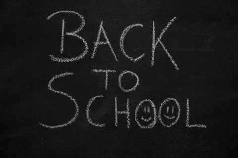 Back to school text on black chalkboard Stock Photos