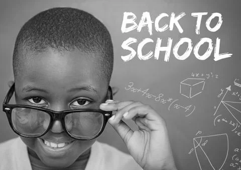 Back to school text on blackboard with boy Stock Photos