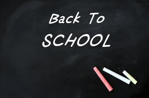 Back to school - text on a blackboard Stock Photos