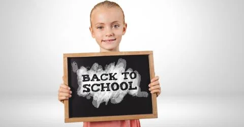 Back to school text on blackboard Stock Photos