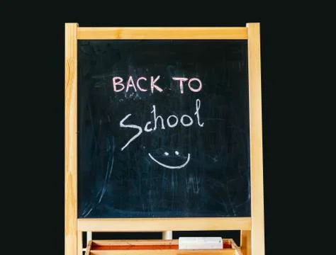 Back to school text on blackboard Stock Photos