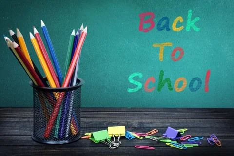 Back to school text on green board Stock Photos