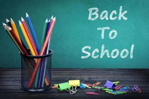 Back to school text on green board Stock Photos