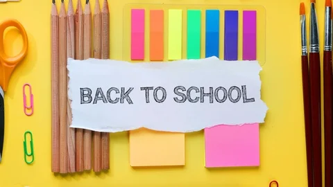 Back To School Text on Torn Paper. School Stationary Flat Lay  Timelapse 4K Stock Footage 93626294