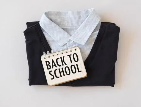 Back To School text written on a notebook lying on a shirt, the concept of .. Foto stock